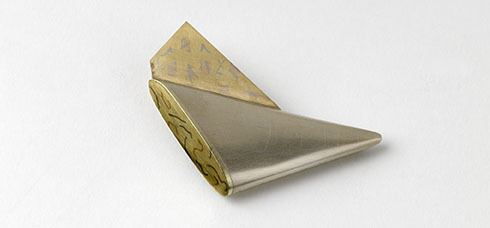 Triangular Winged Brooch With Yellow Gold Wing, 1977-78, Crafts Council Collection: J87. Photo: Todd-White Art Photography.